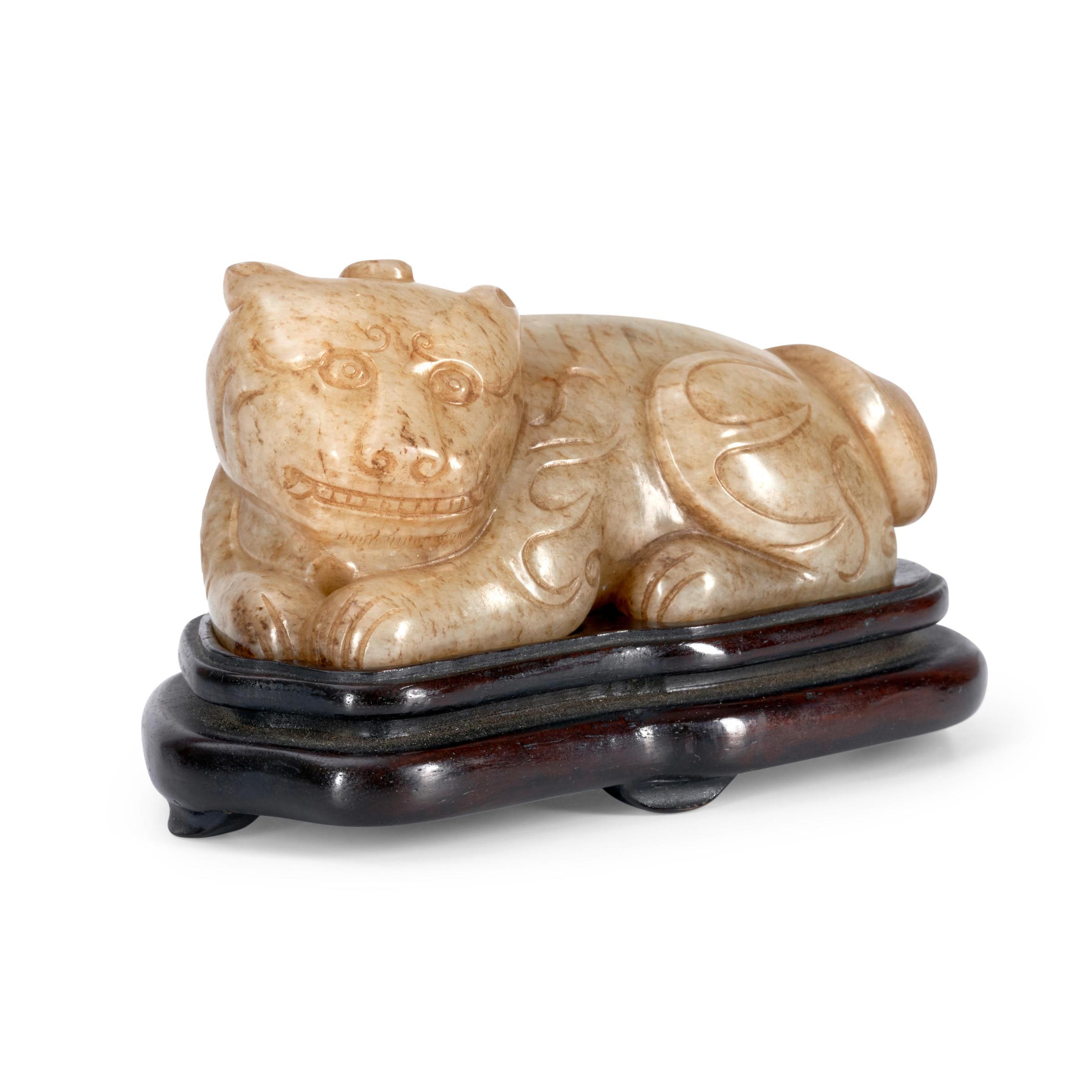A YELLOW JADE CARVING OF A HORNED MYTHICAL CREATURE China, late Qing dynasty image 1