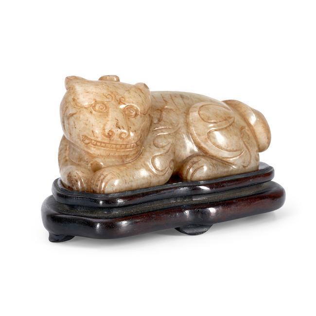 A YELLOW JADE CARVING OF A HORNED MYTHICAL CREATURE China, late Qing dynasty