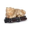 Thumbnail of A YELLOW JADE CARVING OF A HORNED MYTHICAL CREATURE China, late Qing dynasty image 1