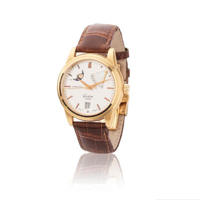 Glashütte Original. An 18K gold automatic calendar wristwatch with moon phases and power reserve indication Glashütte Original. Montre bracelet en or jaune 18K (750) avec date, phases de lune et indication de réserve de marche mouvement automatique Senator, Circa 2000